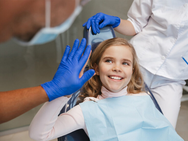 Girl smiling in the dental chair