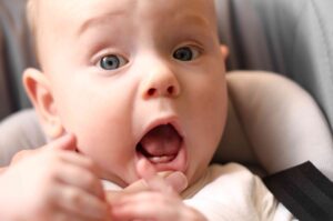 A baby with erupted teeth